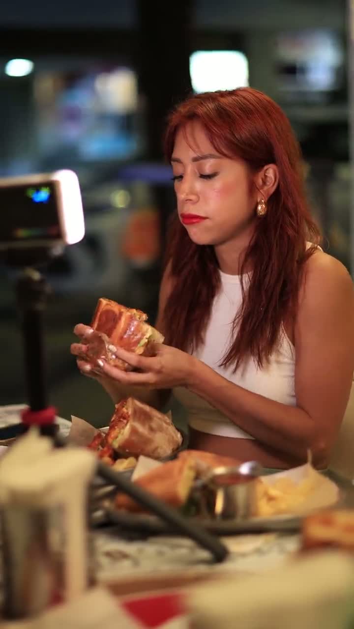 Creator filming a sandwich at a local restaurant